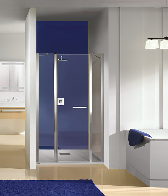 Arrangement of a white and navy blue bathroom with Prestige shower enclosure